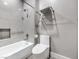 Bright bathroom with a clean bathtub and shower combination and a modern toilet at 5 Clear Crossing Trl, Henderson, NV 89052