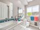 Bright bathroom featuring double sinks, and under sink storage at 5 Clear Crossing Trl, Henderson, NV 89052
