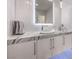 Modern bathroom with stylish vanity, wave tile accent, and sleek fixtures at 5 Clear Crossing Trl, Henderson, NV 89052