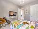 Cozy bedroom with playful bedding and an mounted TV screen at 5 Clear Crossing Trl, Henderson, NV 89052