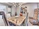 Unique dining room featuring custom table and chairs with modern chandelier at 5 Clear Crossing Trl, Henderson, NV 89052