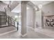 Bright foyer featuring modern staircase, beautiful artwork, and designer lighting, creating a grand entrance at 5 Clear Crossing Trl, Henderson, NV 89052