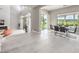 Open-concept living area with floor-to-ceiling windows, a fireplace, and an adjacent dining space at 5 Clear Crossing Trl, Henderson, NV 89052