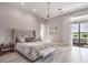 Spacious main bedroom boasts wood floors, recessed lighting, and private access to the outdoor patio at 5 Clear Crossing Trl, Henderson, NV 89052