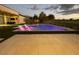 Stunning pool area with lounge chairs, ambient lighting, and elegant patio for relaxation and entertaining at 5 Clear Crossing Trl, Henderson, NV 89052