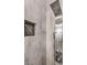 This luxurious shower is complete with multiple shower heads, rainfall shower, and custom tile at 5 Clear Crossing Trl, Henderson, NV 89052