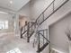 Hallway showcasing a modern staircase with sleek railings and neutral decor, accented by a sculpture at 5 Clear Crossing Trl, Henderson, NV 89052