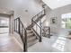 Bright staircase with gray and black design elements, featuring modern railings and neutral decor at 5 Clear Crossing Trl, Henderson, NV 89052