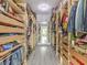 Spacious walk-in closet featuring custom shelving and wood drawers for ample storage at 5 Clear Crossing Trl, Henderson, NV 89052