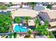 Aerial view showcases a backyard pool, lush landscaping, and a charming neighborhood setting at 5 Red Fawn Ct, Henderson, NV 89074