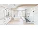 Luxurious bathroom featuring a modern soaking tub and walk in shower with unique tiling at 5 Red Fawn Ct, Henderson, NV 89074