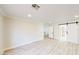 Spacious bedroom featuring modern vinyl floors and a barn door to the bathroom at 5 Red Fawn Ct, Henderson, NV 89074