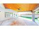 Spacious covered patio showcases a wood ceiling, tiled floor, and seamless access to the backyard at 5 Red Fawn Ct, Henderson, NV 89074