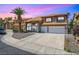 Charming two-story home features a tile roof, desert landscaping, and a spacious driveway at 5 Red Fawn Ct, Henderson, NV 89074