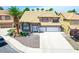 Beautiful two-story house with a large driveway, desert landscaping and tile roofing at 5 Red Fawn Ct, Henderson, NV 89074