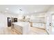 This gorgeous kitchen features a large center island, stainless steel appliances, and modern white cabinets at 5 Red Fawn Ct, Henderson, NV 89074