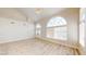 Bright and airy living room with sleek floors, high ceilings, and statement lighting fixture at 5 Red Fawn Ct, Henderson, NV 89074