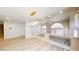 Spacious living area featuring updated flooring, modern lighting, and view of the entry at 5 Red Fawn Ct, Henderson, NV 89074