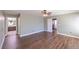 Large primary bedroom featuring wood floors, ceiling fan, and ensuite bath at 5031 Naff Ridge Dr, Las Vegas, NV 89131