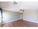 Spacious bedroom with wood floors, a ceiling fan, and ample natural light at 5031 Naff Ridge Dr, Las Vegas, NV 89131
