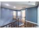 Upstairs hallway with wood floors and blue accent walls at 5031 Naff Ridge Dr, Las Vegas, NV 89131
