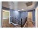 Hallway with wood floors, blue walls, and wooden railing at 5031 Naff Ridge Dr, Las Vegas, NV 89131