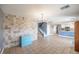 Open-concept space with tiled floors and a view of the staircase and kitchen at 5031 Naff Ridge Dr, Las Vegas, NV 89131
