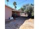 Covered patio with outdoor furniture in a yard with minimal landscaping at 5324 Del Monte Ave, Las Vegas, NV 89146