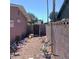 Narrow side yard with several bicycles and a gate at 5324 Del Monte Ave, Las Vegas, NV 89146