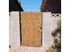 Wooden backyard gate between concrete walls at 5324 Del Monte Ave, Las Vegas, NV 89146