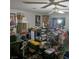 A cluttered living room with a ceiling fan and various items throughout the space at 5324 Del Monte Ave, Las Vegas, NV 89146