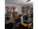 A cluttered living room with a ceiling fan and various items throughout the space at 5324 Del Monte Ave, Las Vegas, NV 89146
