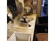A cluttered sink area with a faucet and cleaning supplies at 5324 Del Monte Ave, Las Vegas, NV 89146