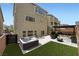 Backyard with hot tub, an outdoor sitting area, and low maintenance turf at 5340 Kennedy Hill Ave, Las Vegas, NV 89139