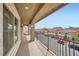 A covered balcony overlooks a quiet residential street with well-maintained homes at 5340 Kennedy Hill Ave, Las Vegas, NV 89139
