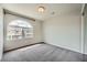 Empty bedroom with carpet, a ceiling light, and a large arched window at 5340 Kennedy Hill Ave, Las Vegas, NV 89139