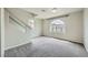 Bright bonus room featuring a large arched window offering neighborhood views at 5340 Kennedy Hill Ave, Las Vegas, NV 89139