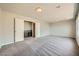 Spacious bonus room with modern lighting, neutral walls, and an adjacent wet bar, perfect for entertaining at 5340 Kennedy Hill Ave, Las Vegas, NV 89139