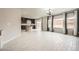 This home features a light and open living room with white tile floors and large windows at 5340 Kennedy Hill Ave, Las Vegas, NV 89139