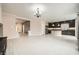 This home features a light and open living room connected to the kitchen, with white tile floors at 5340 Kennedy Hill Ave, Las Vegas, NV 89139