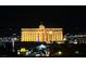 Building is lit up against the dark sky with city lights in the distance at 5340 Kennedy Hill Ave, Las Vegas, NV 89139