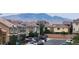 Residential street with two-story houses, cars parked, and mountain views in the background at 5340 Kennedy Hill Ave, Las Vegas, NV 89139