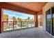 Balcony overlooking a pool with a glass border and sliding doors that lead into an interior space at 55 E Agate Ave # 309, Las Vegas, NV 89123
