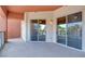 Condo balcony with gray concrete flooring and sliding glass doors that lead to other rooms at 55 E Agate Ave # 309, Las Vegas, NV 89123