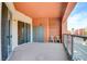 Balcony with concrete flooring, a protective glass border, and two blue chairs for relaxing at 55 E Agate Ave # 309, Las Vegas, NV 89123