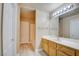 Bathroom features a single vanity, neutral colors, tub, and white cabinets that offers storage at 55 E Agate Ave # 309, Las Vegas, NV 89123