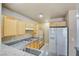 Functional kitchen featuring granite countertops, modern appliances, light wood cabinetry and ample counter space at 55 E Agate Ave # 309, Las Vegas, NV 89123