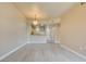 Open-concept living space with modern floors, breakfast bar overlooking the kitchen, and inviting natural light at 55 E Agate Ave # 309, Las Vegas, NV 89123