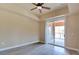 Serene primary bedroom with contemporary flooring, balcony access, and a ceiling fan for added comfort at 55 E Agate Ave # 309, Las Vegas, NV 89123