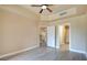 Bright primary bedroom with ceiling fan, modern floors, and multiple doorways, providing ample comfort and privacy at 55 E Agate Ave # 309, Las Vegas, NV 89123